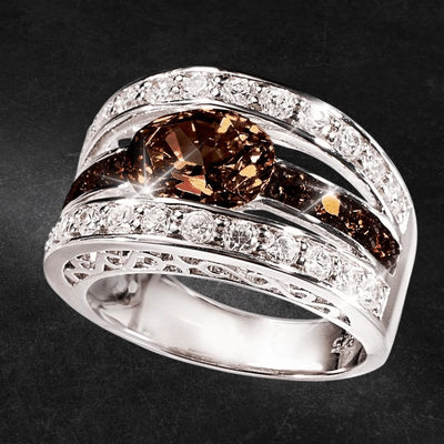 Verona Chocolate Ring featuring a sterling silver band with rhodium plating, adorned with a central chocolate-colored gemstone and sparkling clear stones, designed for women.