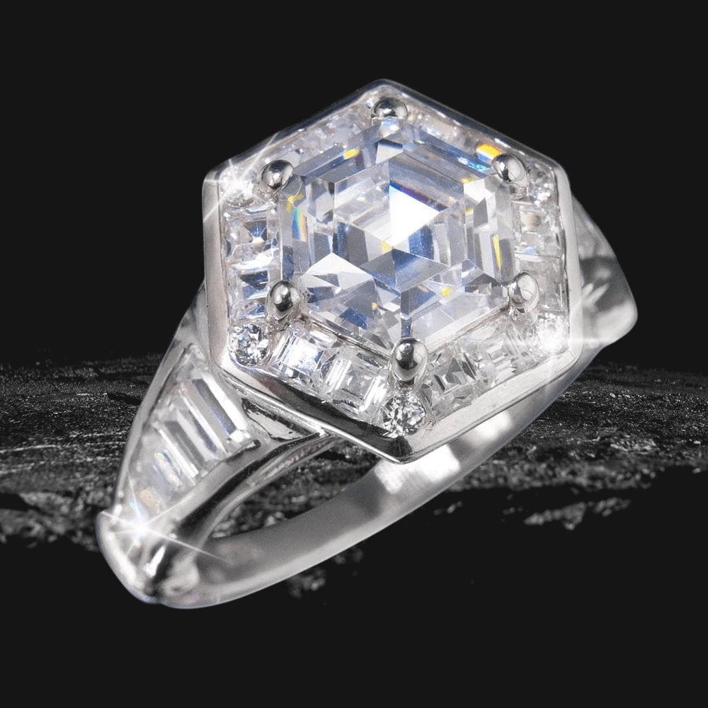 Adelphi Ring featuring a hexagonal clear gemstone centerpiece set in sterling silver with rhodium plating, designed for women’s jewelry collections.