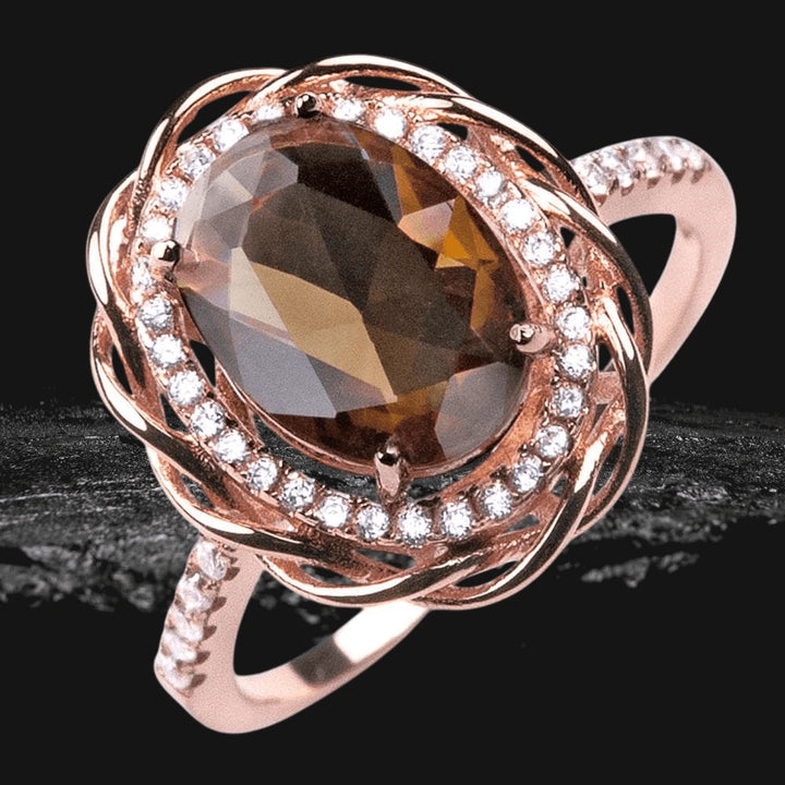 Versa Mocha Ring featuring a large oval mocha gemstone set in sterling silver with rose gold plating, accented by sparkling clear stones around the center and along the band.