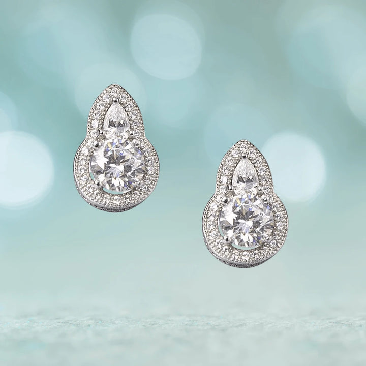 Oleander Earrings crafted in sterling silver with rhodium plating, featuring sparkling clear stones in an elegant teardrop design for women’s jewelry.
