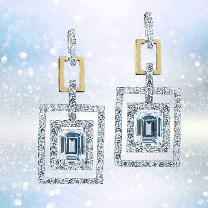 Taboo Earrings in sterling silver with two-tone plating featuring sparkling rectangular crystals set within double square frames, designed for a striking female jewelry statement.