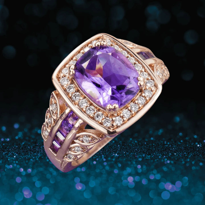 Amethyst Rose Ring featuring a large purple amethyst center stone, surrounded by sparkling white stones, set on sterling silver with rose gold plating, designed for women.