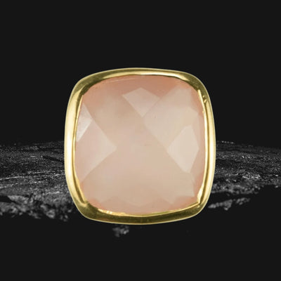 Close-up of Dream Gems Earrings Pink Quartz featuring a polished pink quartz stone set in sterling silver with elegant gold plating, designed for women’s jewelry.
