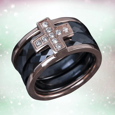 Ceramica Cross Men's Ring features a black stainless steel band with rose gold plating and a rose gold cross adorned with clear crystals, a striking men's jewelry piece.