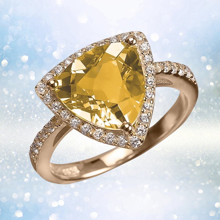 Citrine Sun Ring featuring a triangular citrine gemstone set in a sterling silver band plated with gold, adorned with small sparkling stones, designed for female wearers.