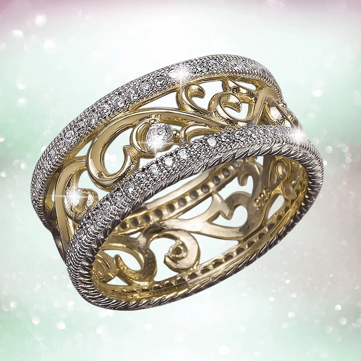 Rococo Garland Ring in sterling silver featuring a two-tone design with intricate filigree and sparkling accents, crafted for a female jewelry collection.