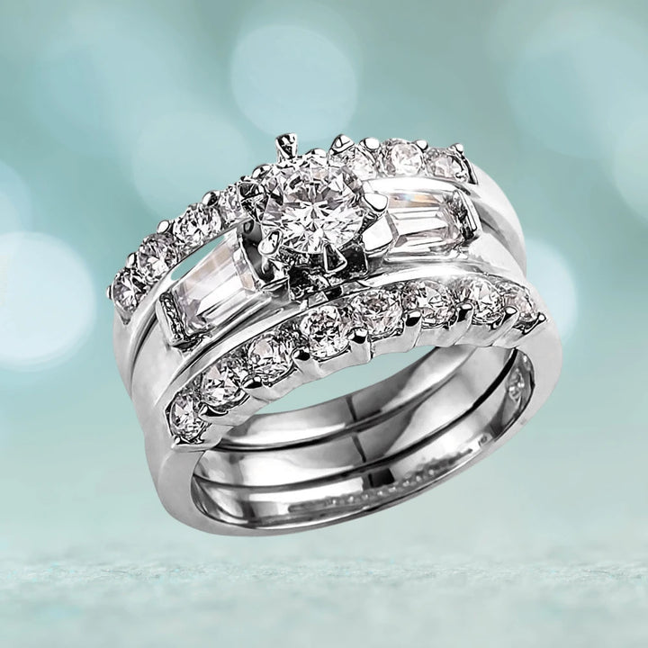 Trina Ring featuring sterling silver with rhodium plating, designed for women, showcasing a sparkling central gemstone surrounded by smaller stones in a sophisticated jewelry style.