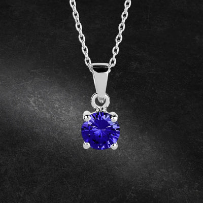 Brilliant Birthstones Pendant September featuring a vibrant blue September birthstone set in sterling silver with rhodium plating, designed for women’s jewelry collections.