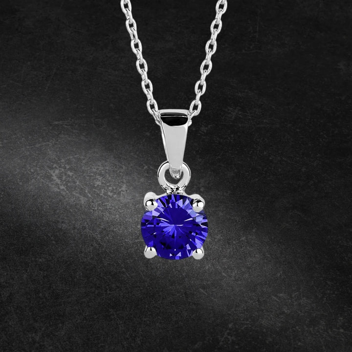 Brilliant Birthstones Pendant September featuring a vibrant blue September birthstone set in sterling silver with rhodium plating, designed for women’s jewelry collections.