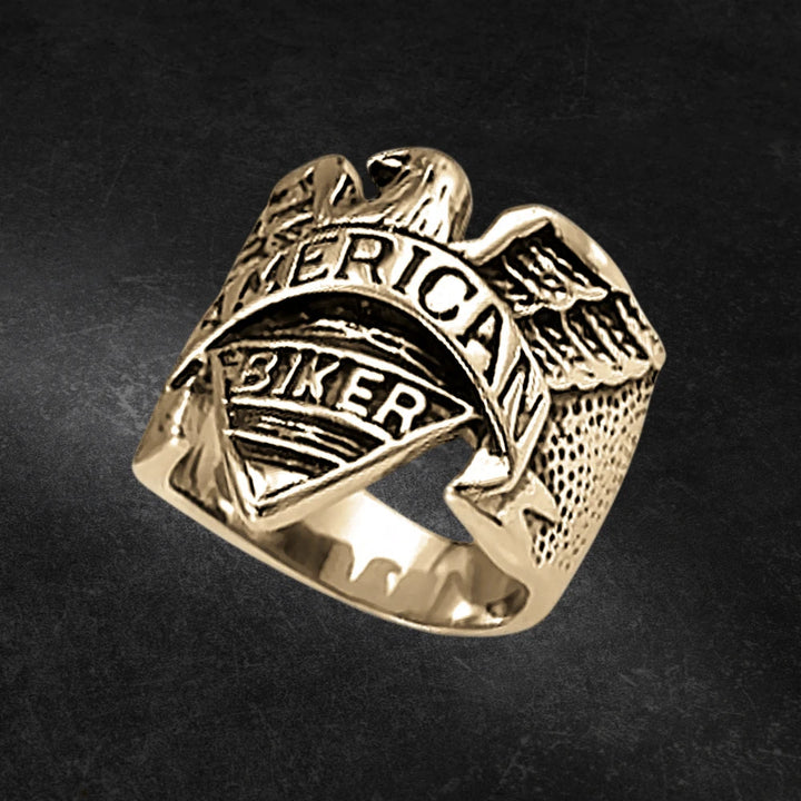 Eagle Rider Ring crafted from gold-plated stainless steel, featuring a detailed eagle design and engraved with "American Biker," a bold men's statement jewelry ring.