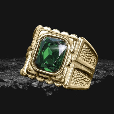Metropole Men's Ring featuring a bold green gemstone set in gold-plated stainless steel with a detailed textured band, designed for men’s jewelry collections.