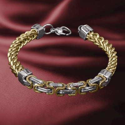 Cedar Foxtail Byzantine Bracelet featuring an intricate two-tone gold and silver chain design for men, displayed on elegant burgundy fabric background.