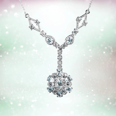 Bonita Topaz Necklace featuring a sterling silver chain with rhodium plating and an intricate pendant adorned with sparkling topaz gemstones, designed for women’s jewelry.