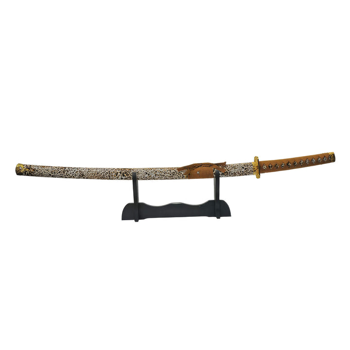 Untamed Samurai Katana Sword displayed on a black stand with an ornate patterned sheath and detailed brown handle Up To 75% Off Retail