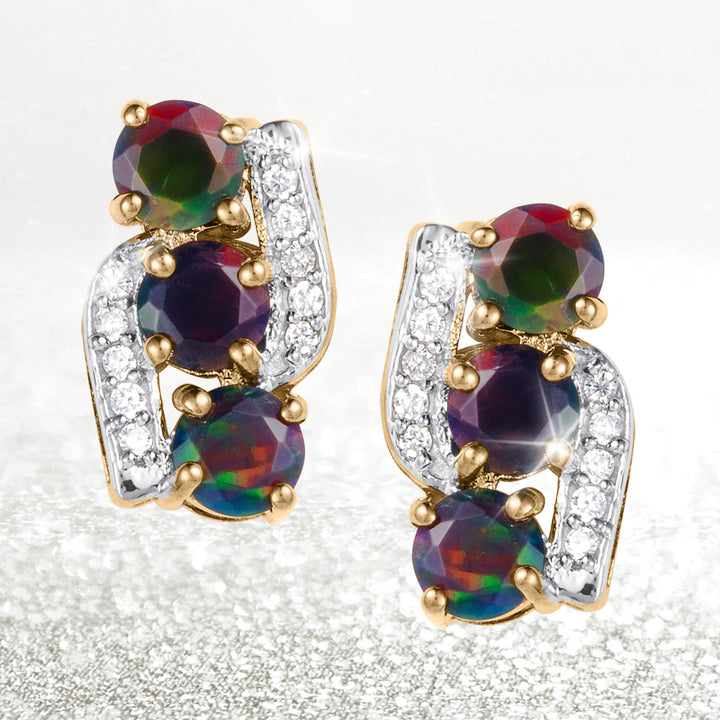 Ember & Eclipse Opal Earrings featuring three iridescent opal gemstones and sparkling clear stones in polished gold tone settings on a white background