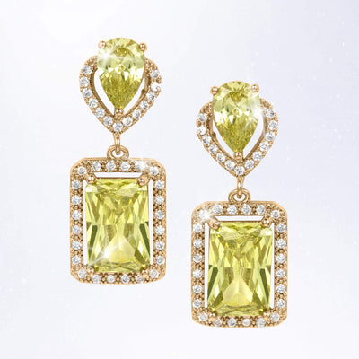 Gold tone drop earrings featuring faceted yellow green gemstones, rectangular pendant settings, and sparkling clear accent stones around the edges