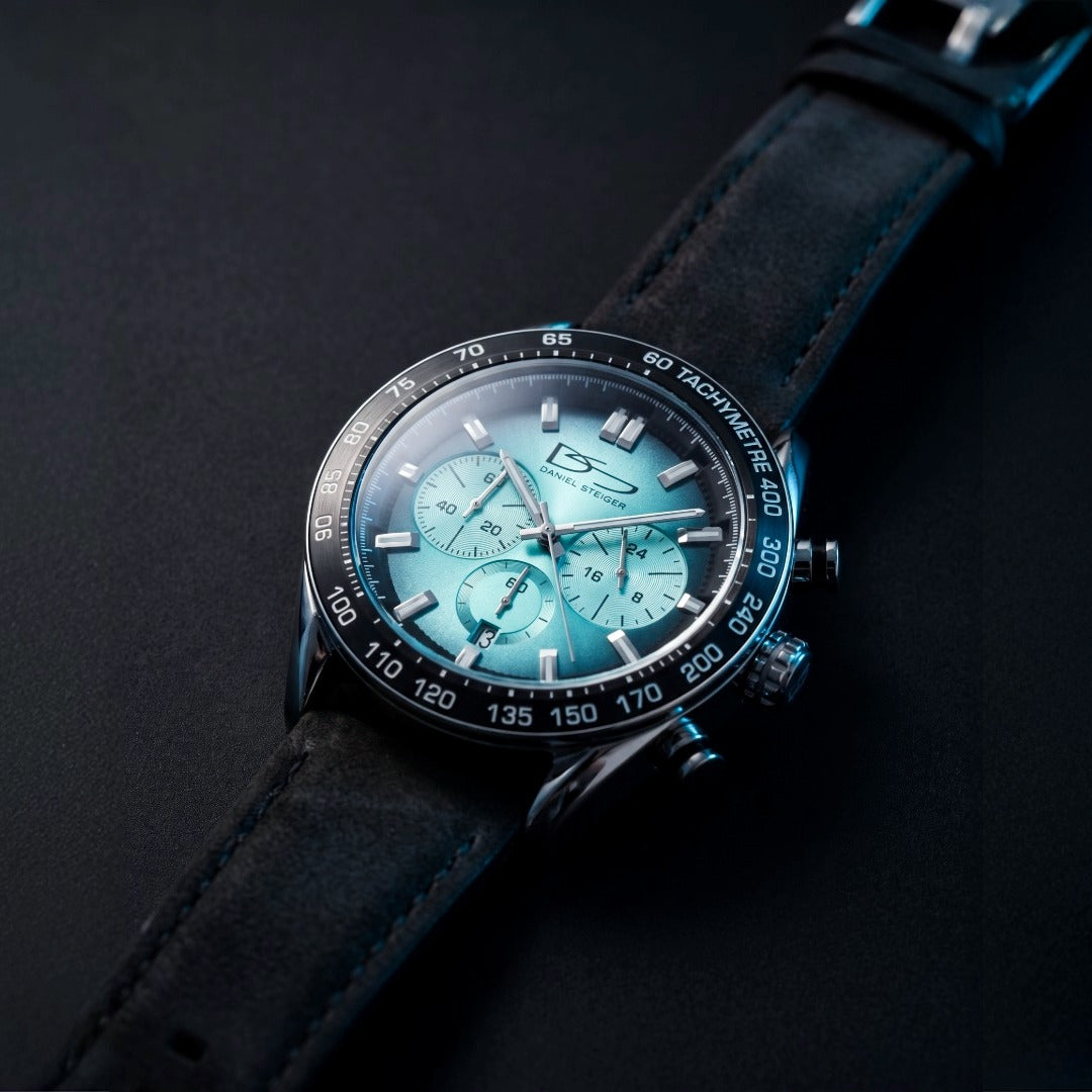 Hydrasteel Chrono Men's Watch with turquoise chronograph dial black leather strap and tachymeter bezel on a dark background Up To 75% Off Retail