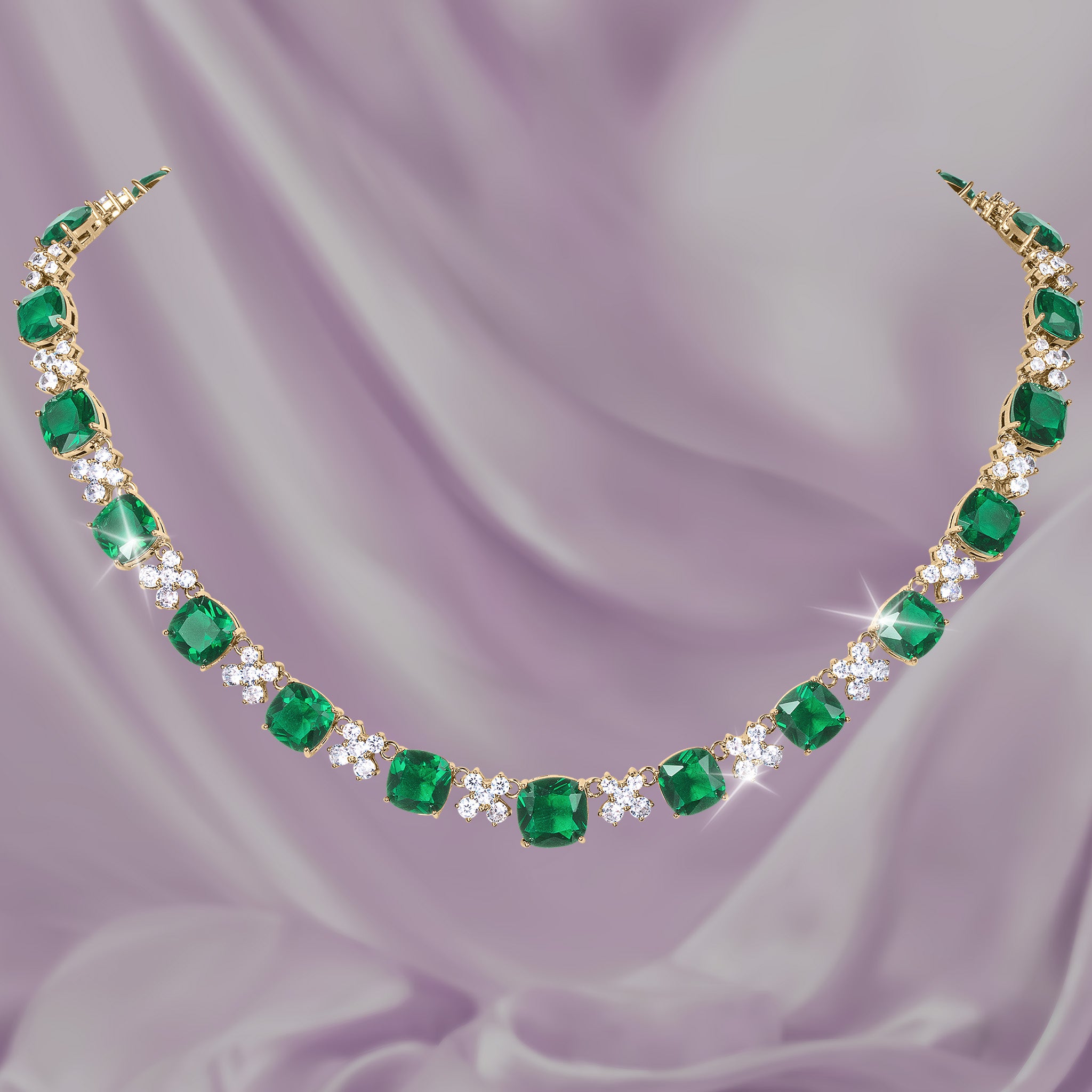 Freya Collection emerald green gemstone necklace with sparkling diamond accents displayed on lavender satin Up To 75% Off Retail
