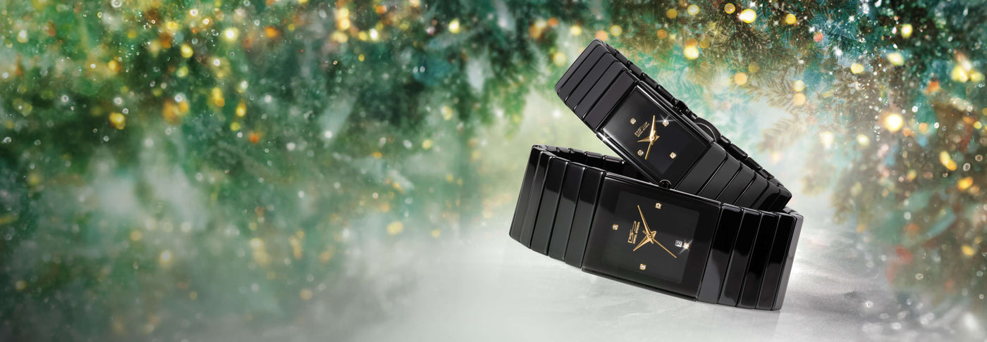 Black ceramic watch band on a decorative background with lights