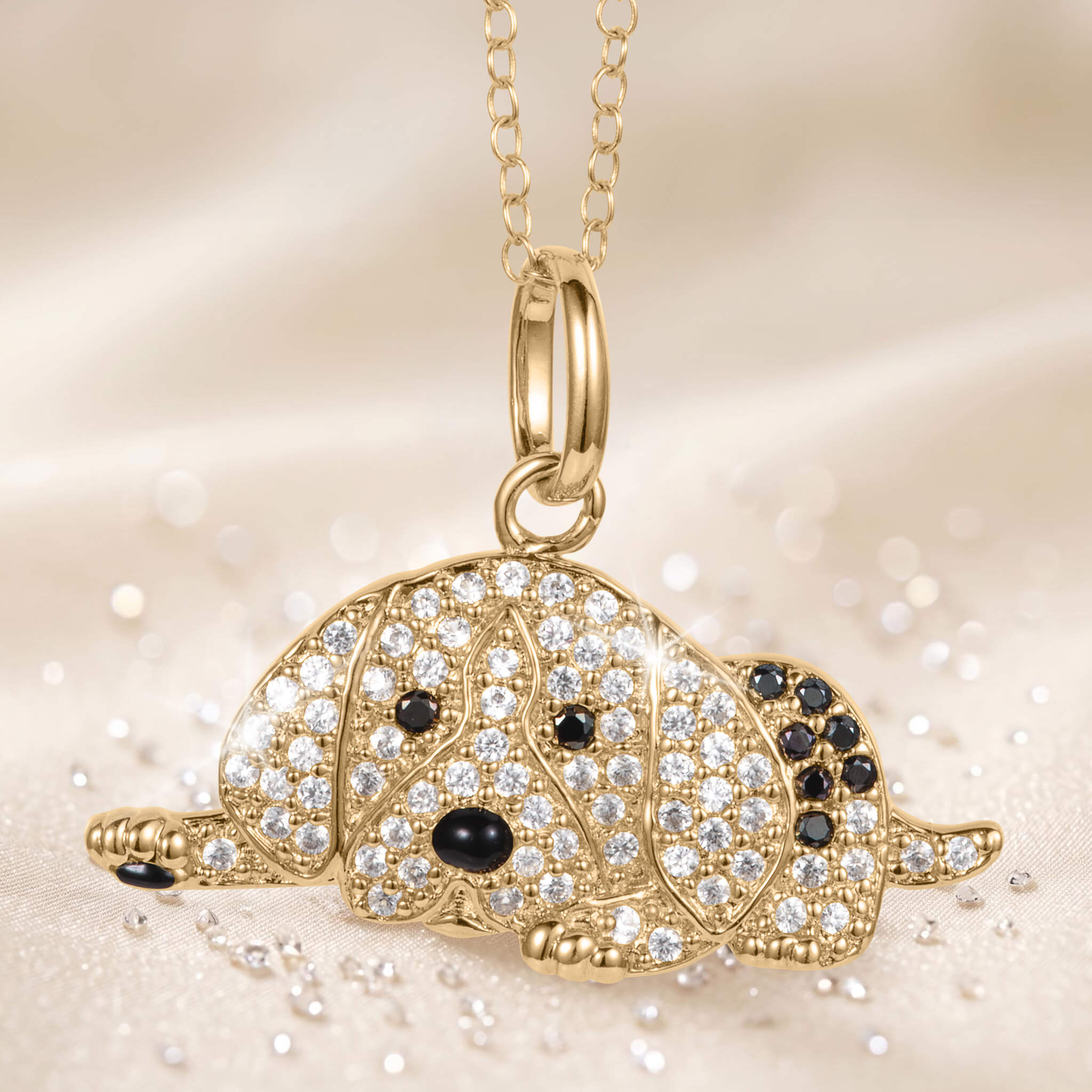 Precious Paws Pendant featuring a gold turtle design with sparkling clear stones and black accents on a delicate chain