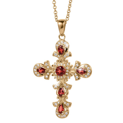 Gold cross-shaped pendant necklace adorned with red gemstones and small clear crystals on a matching gold chain against a white background