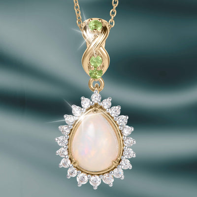 Opal Dew Drop Pendant featuring a luminous teardrop opal with sparkling clear stones and green gemstone accents on a gold tone chain Up To 75% Off Retail