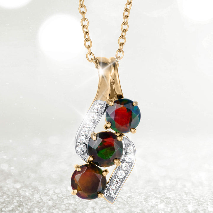 Ember & Eclipse Opal Pendant with a gold chain, colorful opal stones, and sparkling clear accents in an elegant clustered jewelry design. Up To 75% Off Retail.