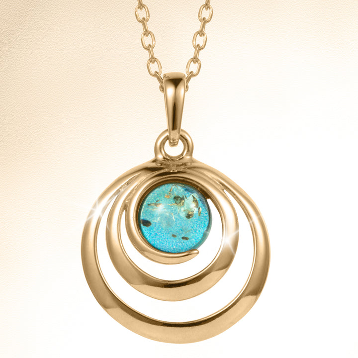 Baltic Lagoon Pendant featuring a polished gold tone spiral design with a vivid turquoise center stone on a linked chain Up To 75% Off Retail
