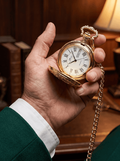 Golden American Eagle Hunter Pocket Watch & Chain held in hand with Roman numeral dial and linked chain. Up To 75% Off Retail.
