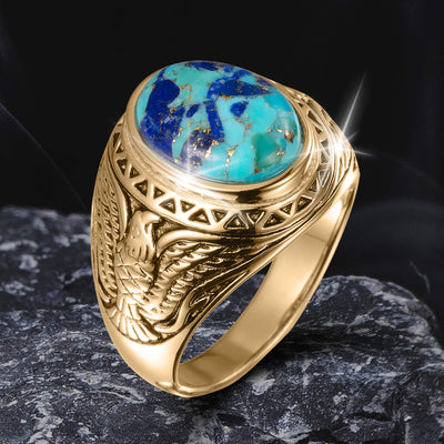 Wings Of Freedom Ring featuring a gold band with intricate eagle wing engravings and a polished turquoise stone centerpiece, designed as distinctive jewelry.