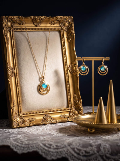 Baltic Lagoon Collection turquoise pendant necklace and matching earrings displayed in an ornate gold frame with Up To 75% Off Retail