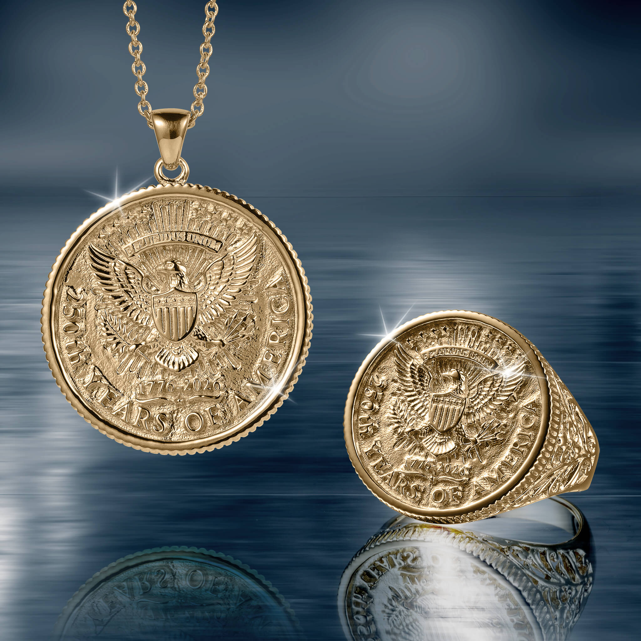 Gold pendant necklace and matching ring set featuring an eagle emblem design, part of the American Glory Collection jewelry line.