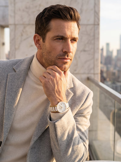 Ceramic Blanc Men's Watch worn by a stylish man in a tailored blazer featuring a gold tone bracelet and white dial Up To 75% Off Retail