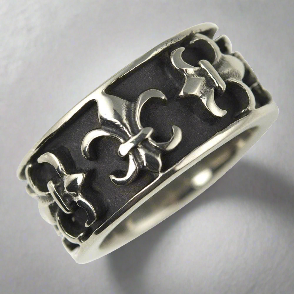 Fiorino Steel Ring for men crafted from stainless steel featuring an intricate raised pattern on a dark textured background, offering a bold and stylish jewelry piece.