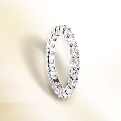 Millionaire Tennis Eternity Ring crafted from sterling silver, featuring a continuous row of sparkling stones designed for women’s jewelry collections.