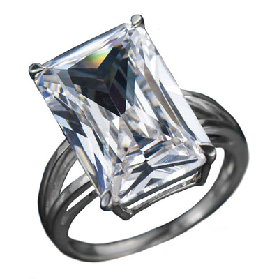 Close-up of a sterling silver Trillionaire Rhodium Ring for female, featuring a large rectangular clear gemstone with rhodium plating and a split shank band design.