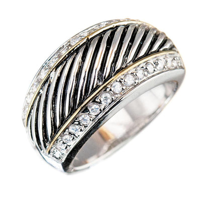 Monte Carlo Ring in two-tone sterling silver featuring diagonal striped detailing and rows of sparkling stones, designed as a unisex jewelry piece.