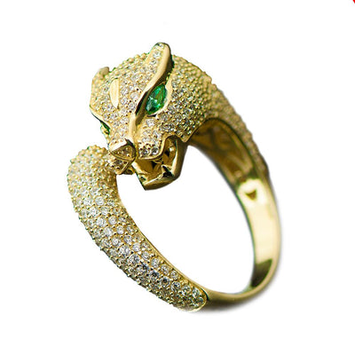 Panther Ring designed for female, crafted from sterling silver with gold plating, featuring a panther head encrusted with sparkling stones and green gemstone eyes.