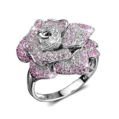 Regal Rose Rhodium Ring crafted from sterling silver with rhodium plating, featuring a detailed rose design adorned with pink and clear stones for an elegant female jewelry piece.